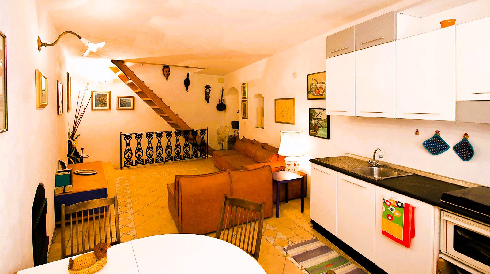 the spacious living area with the staircases typical of tower houses – Fisherman's House